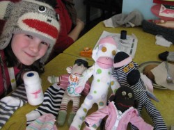 Sock Monkey Girl with her collection of sock monkeys