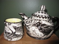 Back side of Crow teapot and mug