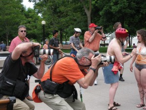 For every naked person, there was a fully-clothed photographer or two